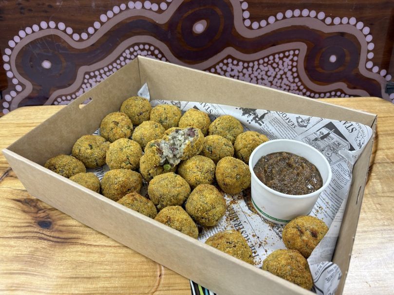 Golden, Crispy Bacon, Lemon Myrtle & Pea Arancini, served with a zesty Pigface Mustard Pickle for a bright, tangy finish.