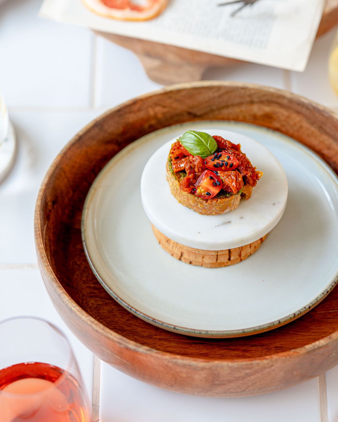 Crostini with Basil Pesto, Mini Tomatoes, Sun-Dried Tomato and Fresh Basil 