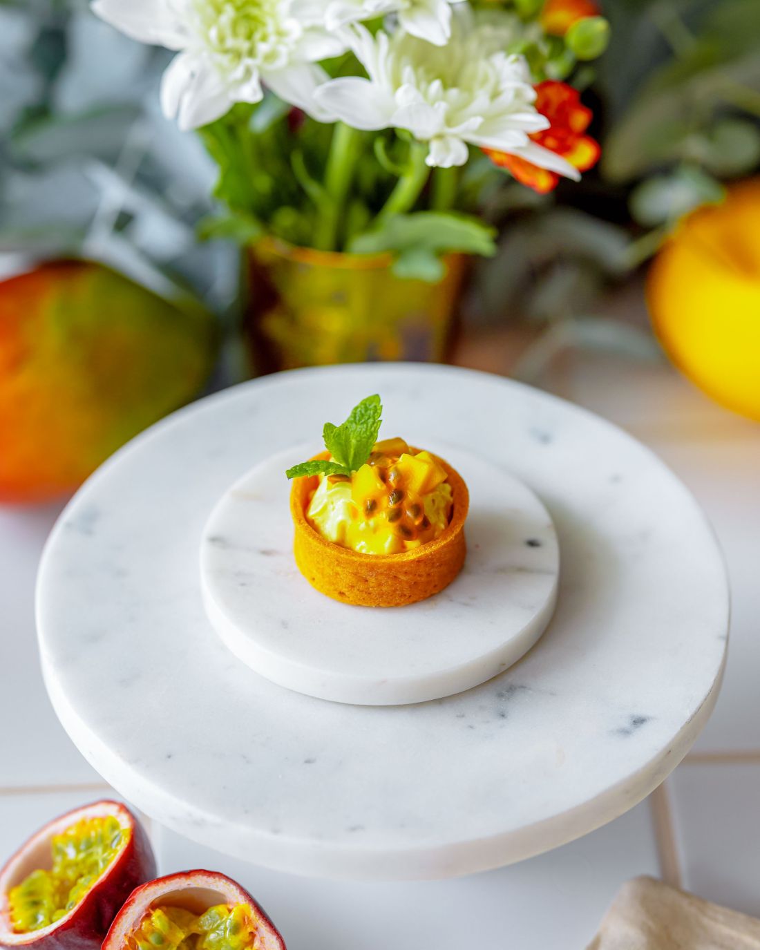 Mango & passion fruit tart with fresh mint