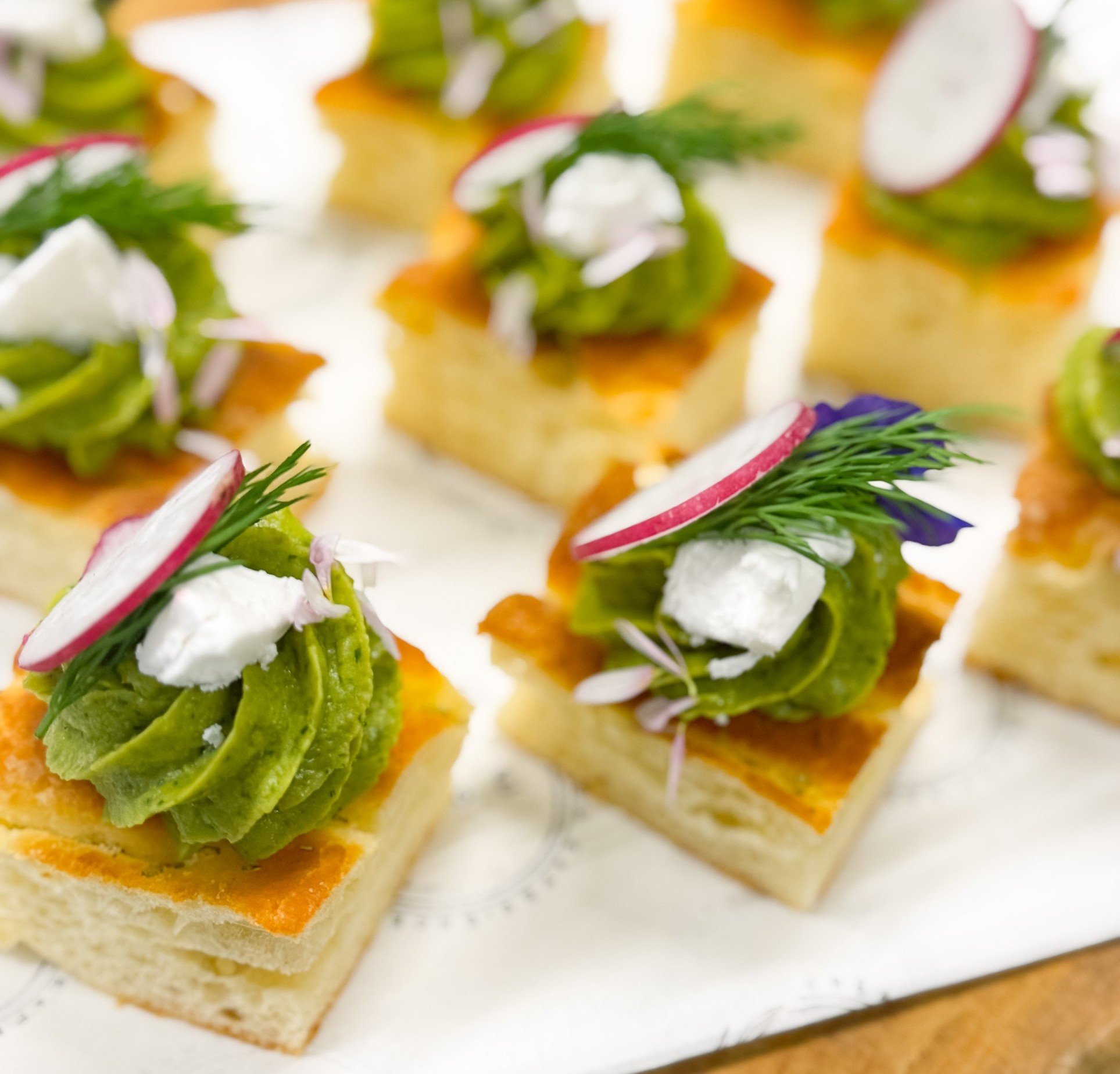  Gluten Free Focaccia Bite with Avocado Cream, Coconut Feta, Radish and Herbs 