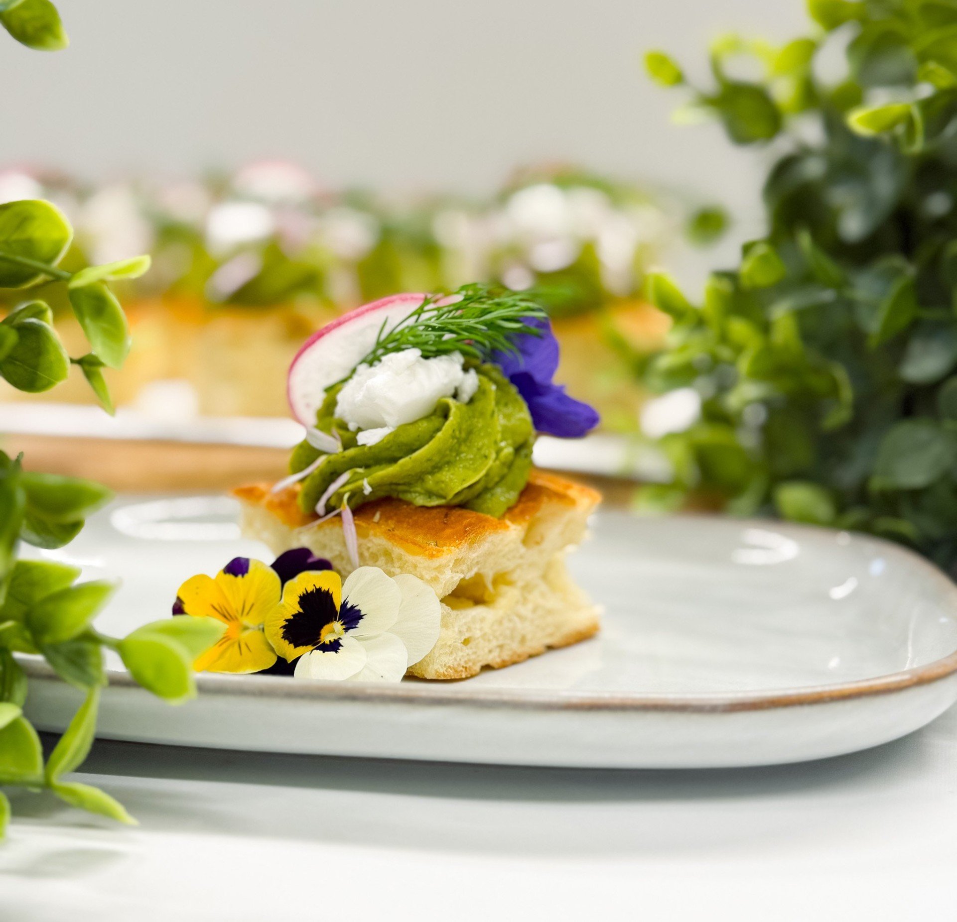  Gluten Free Focaccia Bite with Avocado Cream, Coconut Feta, Radish and Herbs 
