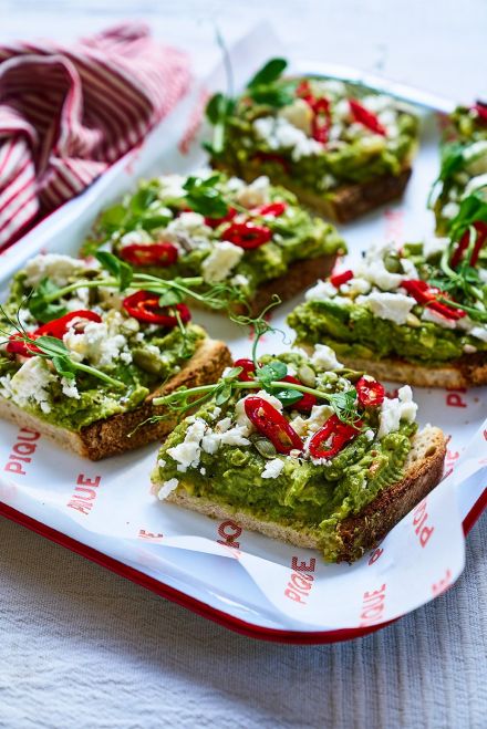 Smashed avocado and peas on sourdough with tahini, sesame & radish