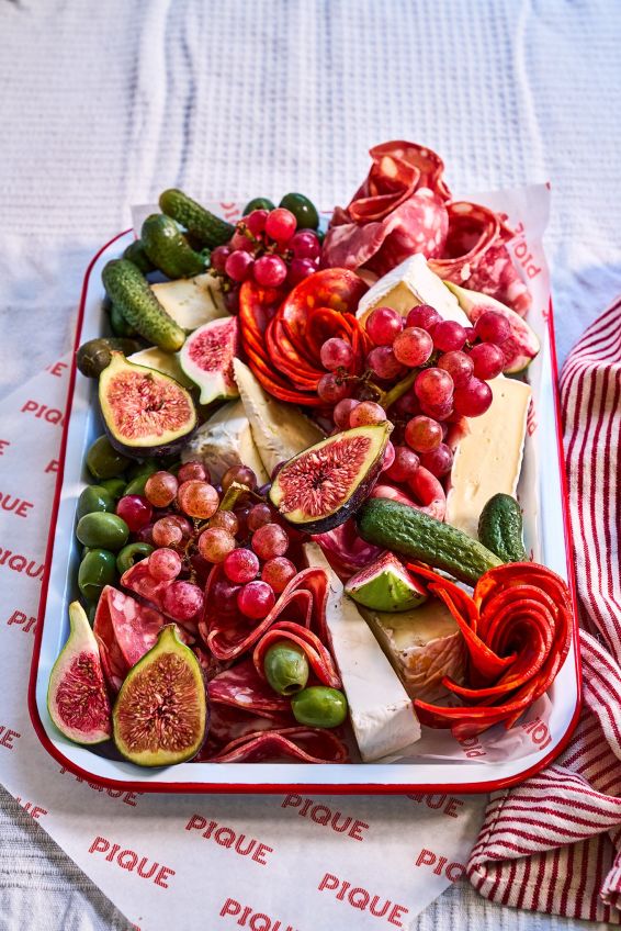 Charcuterie & brie board with pickles, fruit, chutney & Peter’s Yard crackers