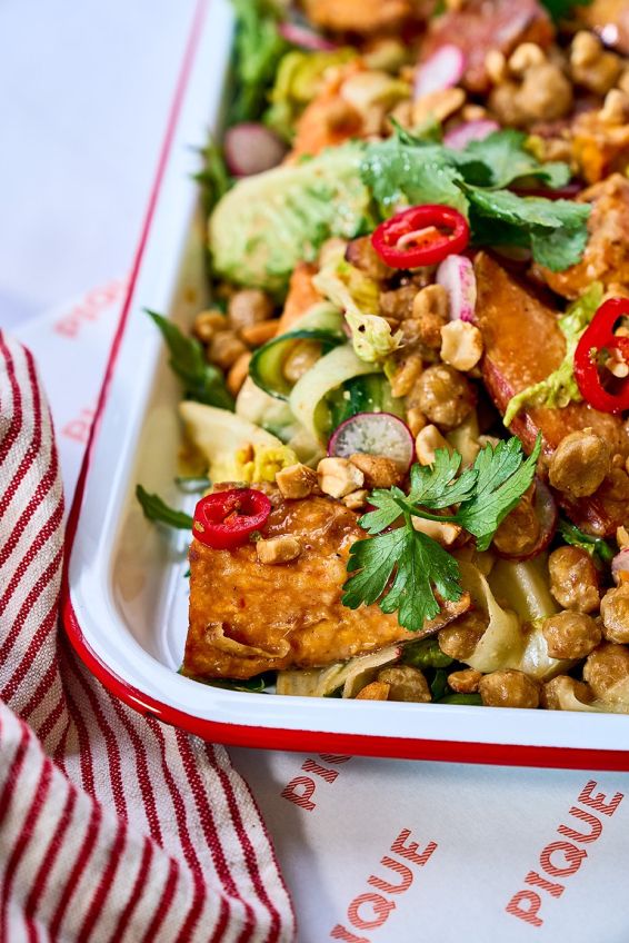 Roasted sweet potatoes with miso chickpeas, peanuts, lime, cucumber & herb salad 