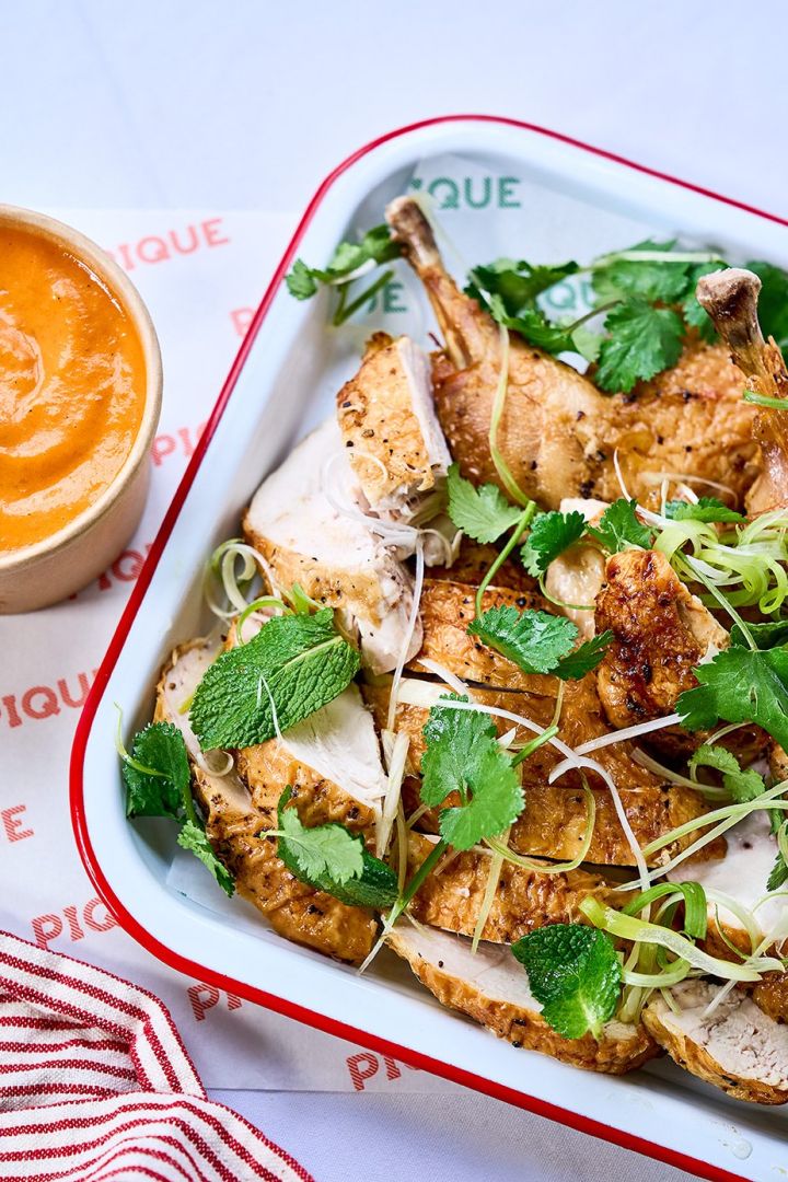 Rotisserie chicken with mojo rojo, spring onions & herbs