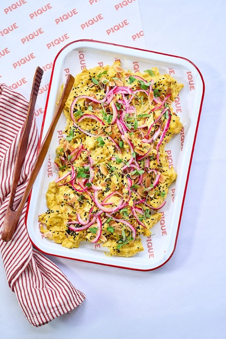 Coronation chicken with toasted almonds and pickled onions