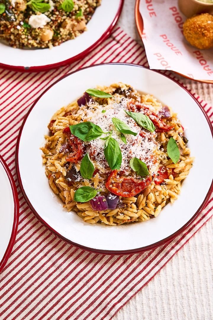 Orzo salad with sun dried tomato pesto, roasted summer veg, basil & Parmesan
