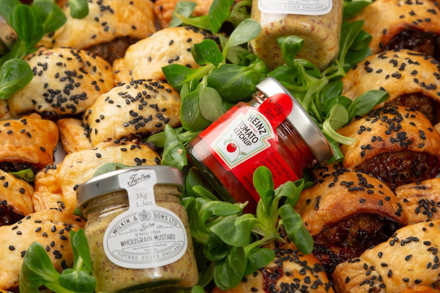 Sausage Rolls with Caramelised Onion Chutney Topped with Black Sesame Seeds - 40
