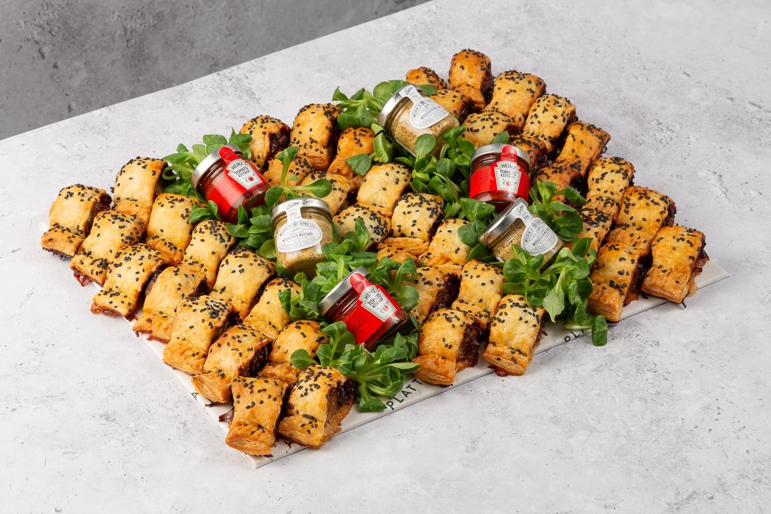 Sausage Rolls with Caramelised Onion Chutney Topped with Black Sesame Seeds - 40