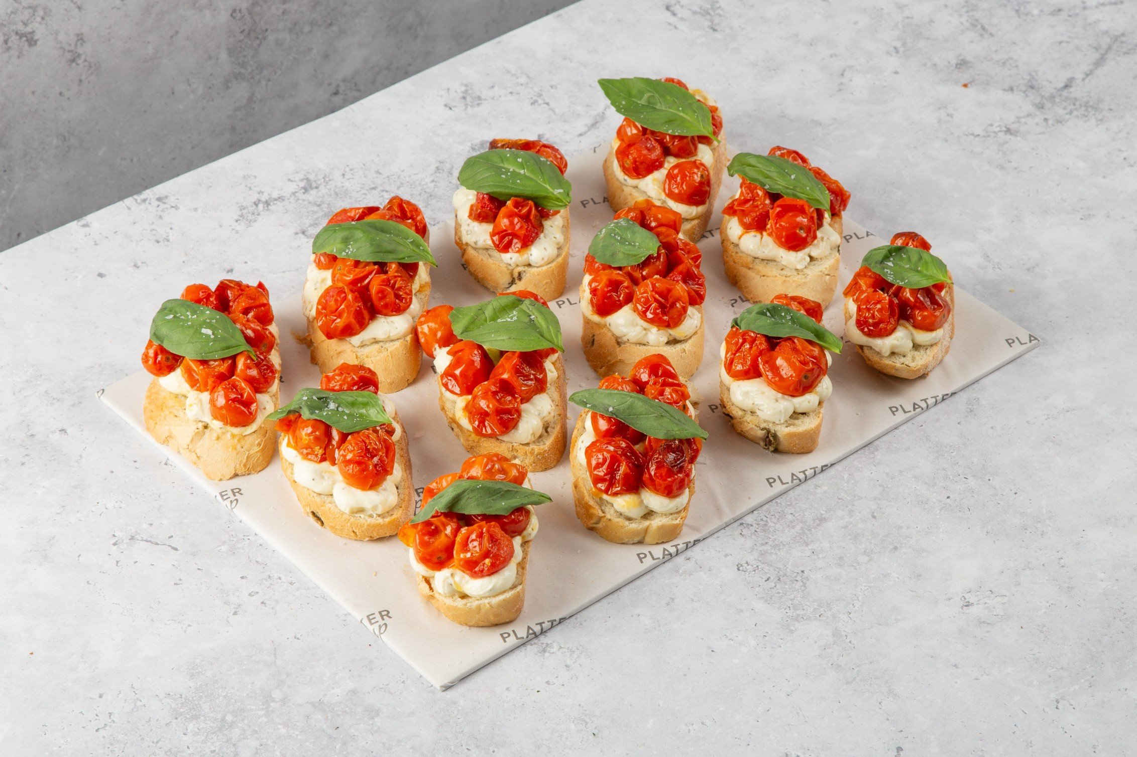Olive Bread topped with Creamy Goats Cheese and Cherry Tomatoes - 12